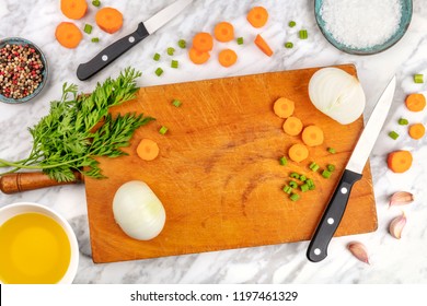 Prep Time, Or Mise En Place. An Overhead Photo Of Professional Chef's Knives, Shot From Above On A Cutting Board, With Chopped Vegetables, And Spices, On A Marble Cooking Surface With A Place For Text