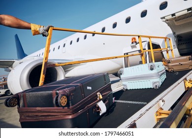 Preparation before flight. Loading of luggage to airplane at airport. 