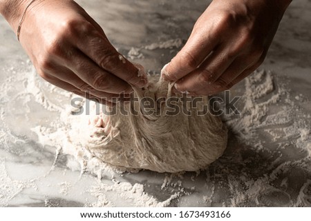 Similar – woman kneading bread dough with her hands