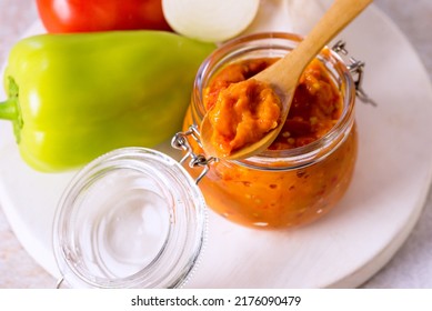 Preparation Of Canned Lecho Canned Tomatoes Peppers Onion Garlic In A Glass Jar Above Horizontal