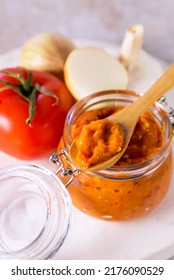 Preparation Of Canned Lecho Canned Tomatoes Peppers Onion Garlic In A Glass Jar Above Vertical