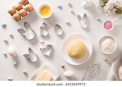 Preparation and cook Easter cookies, cookie cutters, raw dough on baking white background. Top view. Flat lay style. - Powered by Shutterstock