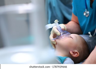Preparation for dental surgery to remove multiple caries. Treatment of baby teeth. General anesthesia. The device of artificial ventilation of lungs.Copy space. - Shutterstock ID 1787929646