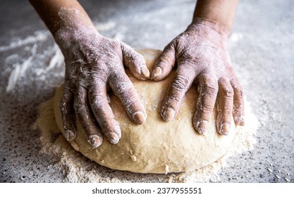 Preparation doughs. Preparation doughs women's hands. Making dough by male hands at bakery. Food concept. Hands dough. Female hands making dough for pizza. Chef in professional kitchen prepares dough - Powered by Shutterstock