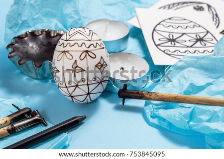 Preparation for Easter holiday. Tools for decorating Paschal eggs, Pysankas, with wax-resist dyeing technique, traditional for Eastern European countries.