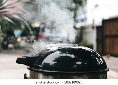 Preparation Food With Smoked In Charcoal Grill. Homemade Cured Meat Method. Backyard No People Background On Day.