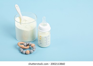 Preparation of formula for baby feeding. Baby health care, organic mixture of dry milk concept. - Shutterstock ID 2002113860
