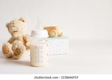 Preparation Of Formula For Baby Feeding. Baby Health Care, Organic Mixture Of Dry Milk Concept.