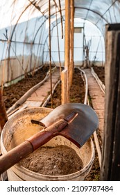 Preparation Of The Ground In The Greenhouse For Planting Vegetables. Winter In The Garden. Shovel In The Foreground