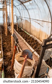 Preparation Of The Ground In The Greenhouse For Planting Vegetables. Winter In The Garden. Shovel In The Foreground