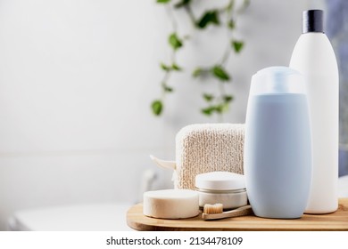 Preparation For Hotel Spa Treatment Or Home Bath Procedure. Bathroom With Accessories And Cosmetics. Shampoo, Shower Gel, Hair Conditioner, Washcloth, Soap, Tooth Brush, Cream Glass Bottle, White Soap