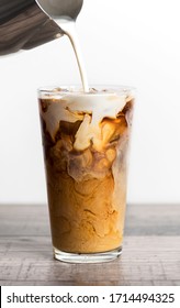 Preparation Of Iced Coffee With Milk Or Cream. Cold Brew Coffee. Iced Latte With Ice Cube And Milk