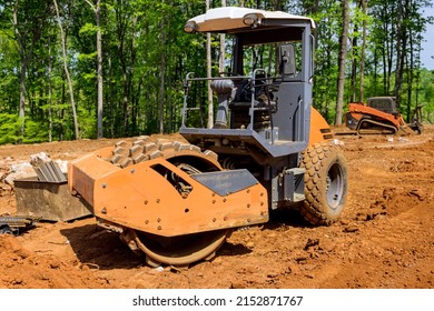 Preparation land for construction site with heavy tractor machinery excavator align the earth doing landscaping