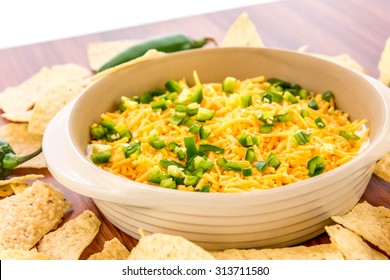 Preparation Of Layered Bean Dip With Jalapenos, Sour Cream And Cheddar Cheese