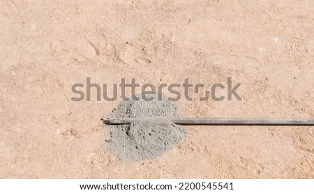 Preparation for laying paving slabs by workers in a private house