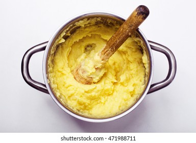 Preparation of mashed potatoes isolated on white background