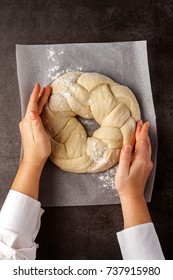Preparation of the round braided challah bread and women's hands