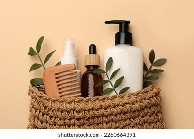 Preparation for spa. Compact toiletry bag with different cosmetic products on beige background, flat lay