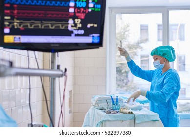 Preparation for surgery. Scrub nurse preparing surgical instruments for operation
