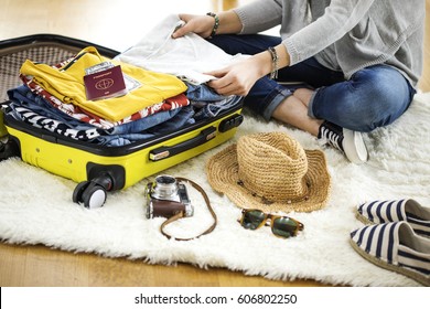 Preparation travel suitcase at home - Shutterstock ID 606802250