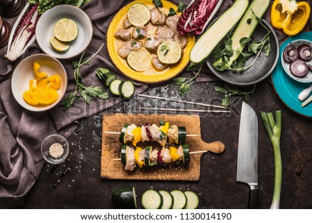 Similar – Foto Bild Hähnchenspieße mit Zucchini und Paprika zubereiten