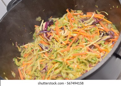 Preparation Of Vegetarian Stir Fry In A Silver Wok