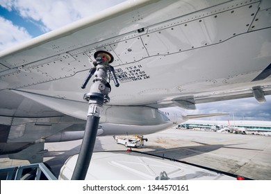 Preparations before flight. Refueling of airplane at airport. Travel and industry concepts.