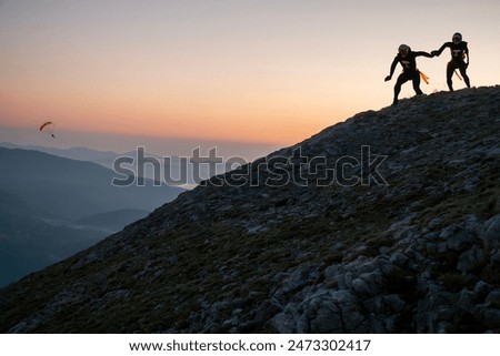 Preparations for flight from the summit with wingsuit