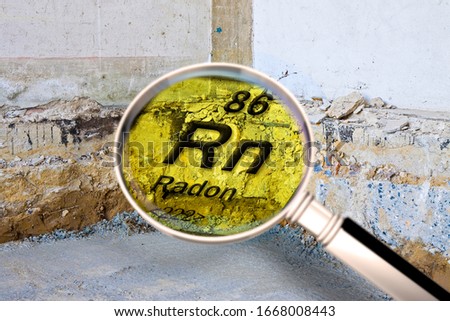 Preparatory stage for the construction of a ventilated crawl space in an old brick building - Searching gas radon concept image seen through a magnifying glass.