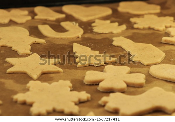 Prepare for Christmas holidays by baking
cookies. Gift for Santa Claus. Thanksgiving biscuits. Cars, trees
and mmany more forms in gingerbread. Concept of family and winter
holidays.