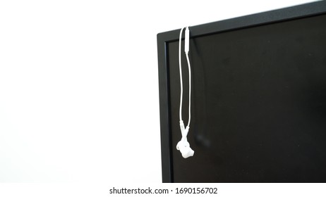 prepare earphone  and microphone on Computerscreen for work from home with white background 