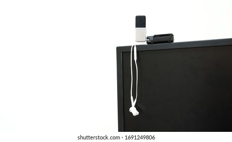 prepare earphone  and microphone on Computerscreen for work from home with white background 