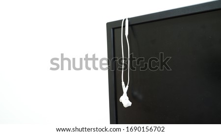 prepare earphone  and microphone on Computerscreen for work from home with white background 