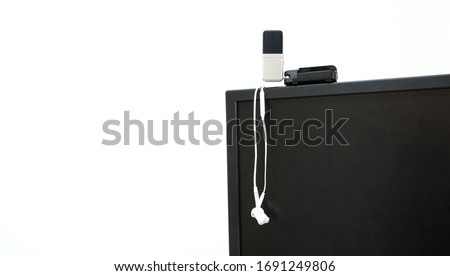 prepare earphone  and microphone on Computerscreen for work from home with white background 