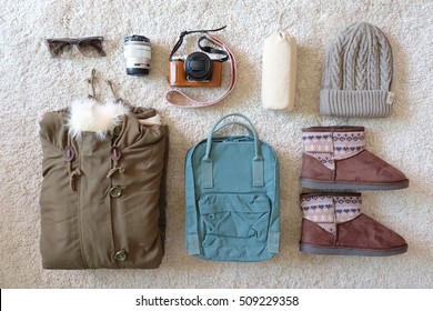 Prepare For Travel. Prepare For Winter. Backpack Coat Boots Hat Sunglasses Camera