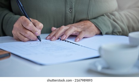 Prepare For The Unexpected. Shot Of An Unrecognizable Businessperson Going Through Paperwork At Work.