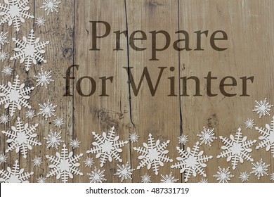 Prepare For Winter Message, White Snowflakes On Weathered Wood Background And Text Prepare For Winter