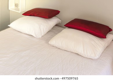Prepared fresh bed, scene in apartments room. Horizontal shot