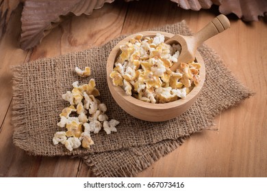 Prepared Popcorn In Bowl On Kitchen Table. Selective Focus.