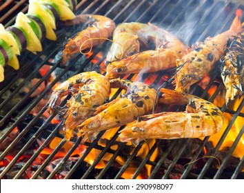 Prepared Shrimp Grilled Barbecued Mixed Seafood In BBQ Flames.