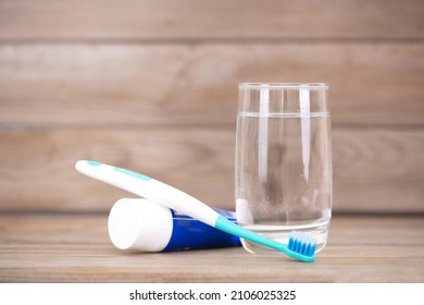 Prepared toothbrush and toothpaste on table