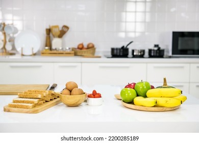 Prepared wholewheat bread, eggs, tomatoes, vegetable, and fruit to make sandwich for morning eat in kitchen. Healthy eating. - Shutterstock ID 2200285189