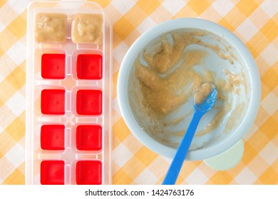 Preparing Baby Food, Homemade. Healthy Smashed Banana Mixed With Breast Milk Preparing To Be Made As An Ice Cube In Ice Cube Tray. Healthy Food Kids Concept. Selective Focus. 