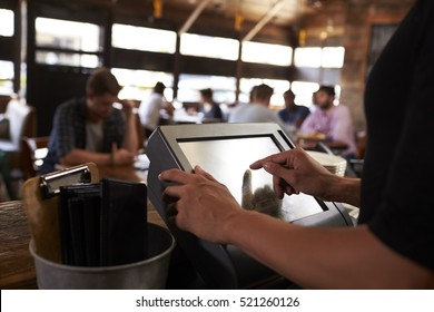 Preparing The Bill At A Restaurant Using A Touch Screen Till