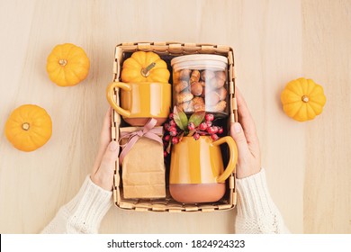 Preparing Care Package For Thanksgiving, Sasonal Gift Box With Cup, Tea Or Coffee Package And Cookies. Personalized Eco Friendly Basket For Fall Holidays. Top View, Flat Lay