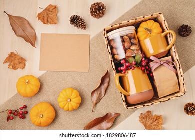 Preparing Care Package For Thanksgiving, Seasonal Gift Box With Cup, Tea Or Coffee Package And Cookies. Personalized Eco Friendly Basket For Fall Holidays. Top View, Flat Lay