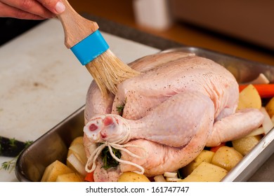 preparing a chicken for the oven