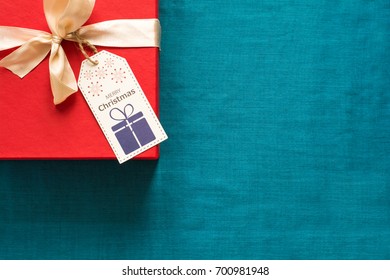 Preparing for Christmas. Red objects on turquoise background. Space for copy. Top view