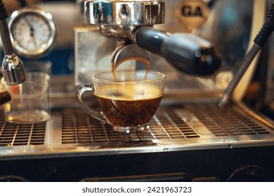 Preparing coffee with coffee maker,Close up of coffee machine pouring coffee