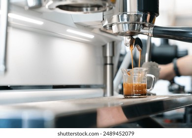 Preparing coffee in coffee shop with professional coffee machine - Powered by Shutterstock